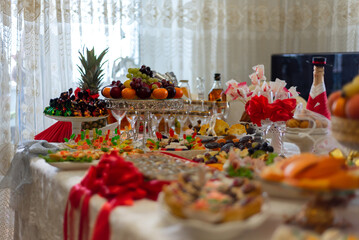 banquet festive wedding table with fruits and sweets 