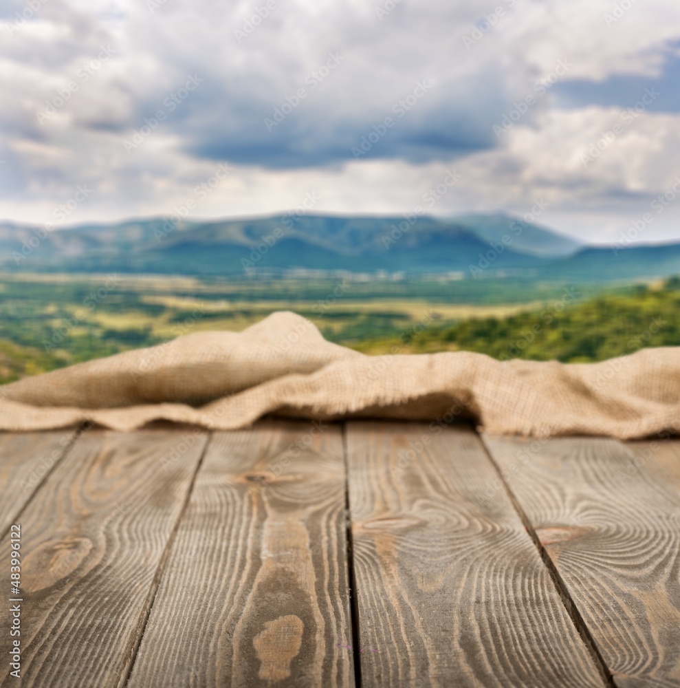 Canvas Prints Empty wooden table with Mountain soft blurry background. Use as products display montage.