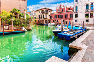 Fototapeta na wymiar Pier in the peaceful canal of Venice, Italy
