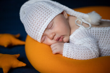 newborn baby sleeps in a sleep cap. close-up