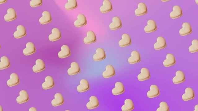 Interesting heartbeat pulse animation pattern with vanilla French Macaroons cookies in heart shape on a trending ligh pink-purpule multi colored gradient background. 3 in 1 animations for 10 sec. Roma