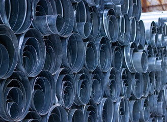 metal ventilation pipes of different sizes stacked 