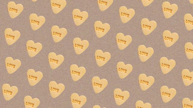 Colorful pattern of  Moving Diagonally on different sides Valentine's Day themed Sweet hearts shaped yellow Sugar Pill Candy isolated on Noise paper texture background. 3 in 1 different sides and size