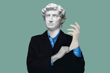 Abstract modern collage. The man with the plaster head of David in suit and blue shirt puts on medical glove on blue background