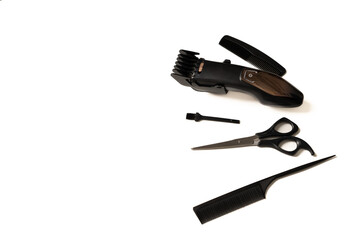 flat lay with hair clipper and hairdressing tools, on white