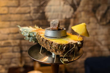 Hookah bowl on pineapple with umbrella