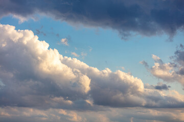 Cloud on blue sky background. Cloudscape grey and orange shade. Twilight light color the cloudy sky