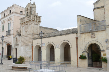 Fototapeta na wymiar Vittorio Veneto square in Matera with the Guerricchio viewpoint under the three arches, next to the Mater Domini church and in front of the Palombaro Lungo