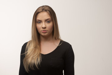 Obraz premium Portrait of sad young woman emotional alone in white background