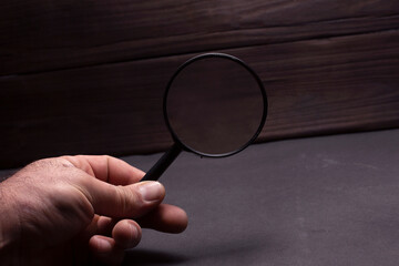 magnifying glass in the woman hand