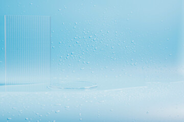 Blue background with transparent glass and water drops. Empty podium for advertising cosmetics...