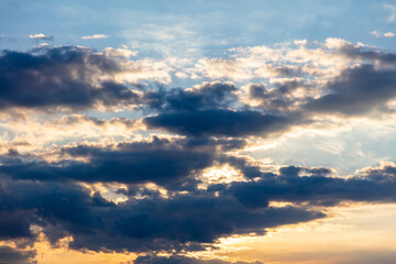 Twilight light color the cloudy sky. Cloud on blue sky background. Cloudscape grey and orange shade.