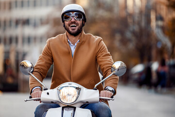 Businessman driving scooter © ivanko80