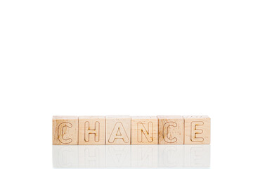 Wooden cubes with letters Chance on a white background