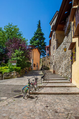 Fototapeta na wymiar Cobblestones Stairway and Bicycles in Annecy, France