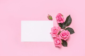 Valentines day gift blank and pink roses bouquet on pink background