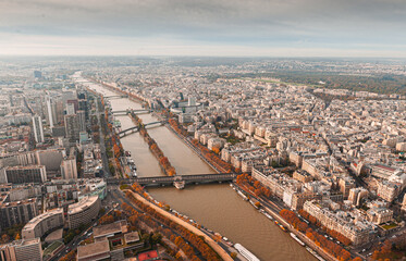 Paris buildings from city centre view from above on the top of Eiffel Tower during an amazing autumn day. Travel in France.