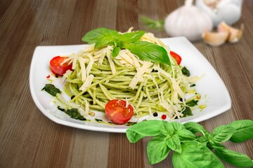 Classic italian pasta pesto with pound garlic, basil leaves, hard parmesan cheese