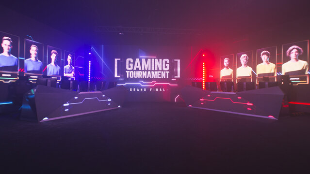 LED monitor with Gaming Tournament Grand Final inscription with spotlights and neon illumination in dark modern room with tables and computers