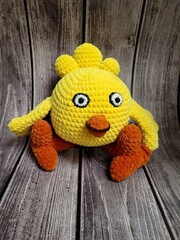 Toy chicken on wooden background. handmade