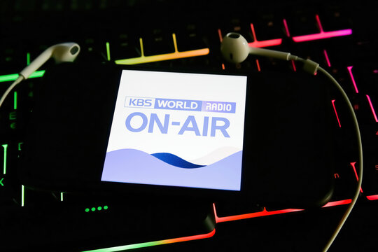 Viersen, Germany - January 9. 2022: Closeup of mobile phone with logo of korea radio station kbs world on computer keyboard