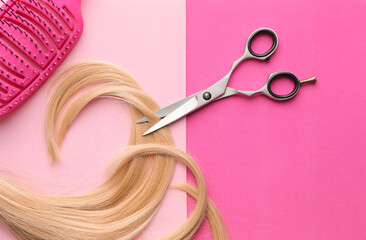 Hairdresser's scissors with strand of blonde hair