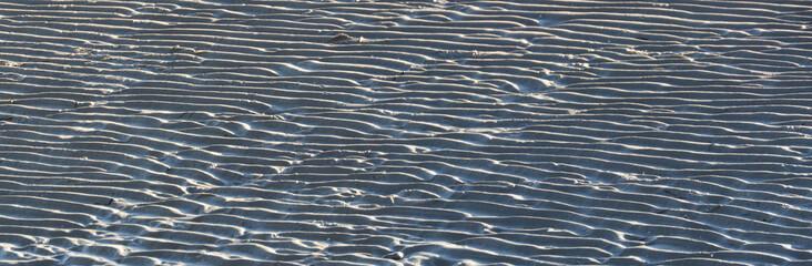 Wrinkled sandy bottom at the low tide