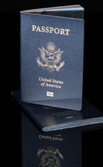 US Passports on dark background with reflection