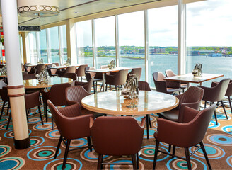 Tables and chairs in cruise ship restaurant