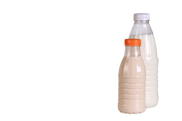 cow's milk and melted milk in plastic bottles stands on a white background