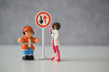 a road worker or a worker with a jackhammer in various situations on the road, dolls 