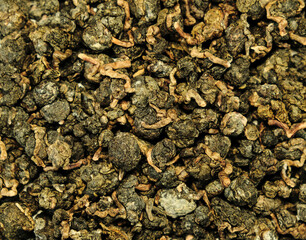 Tea leaves. Oolong. Green chinese tea leaves. Healthy organic. Macro photo.