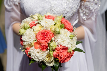Bride with wedding bouquet, closeup