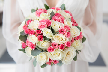 Bride with wedding bouquet, closeup