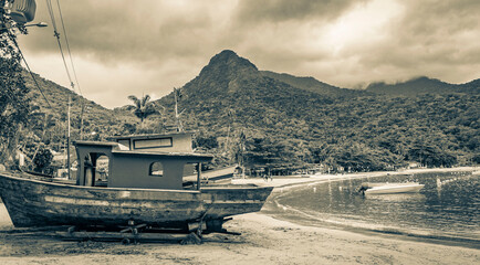 Old boats ships for restoration Abraao beach Ilha Grande Brazil.