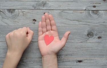 hands holding a heart , Valentine's day , 14 february .Declaration of love . valentine , two hearts . Valentines in the shape of a heart in hand .