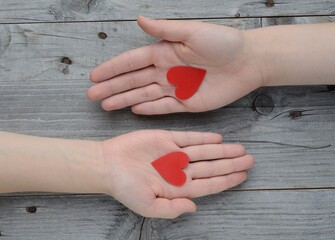 Valentine's day , 14 february .Declaration of love . valentine , two hearts . Valentines in the shape of a heart in hand .