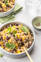 Vegan meal of quinoa with corn and black beans. Healthy organic vegan food