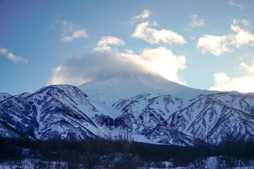 Fototapeta na wymiar Snow covered Vilyuchinsky volcano in winter