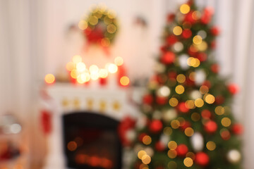 Blurred view of room with Christmas tree near fireplace
