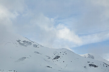 Top of snow capped mountains during the winter time