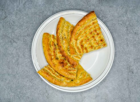 Traditional Indian Food Roghni Naan In White Plate Top Vie On Grey Background