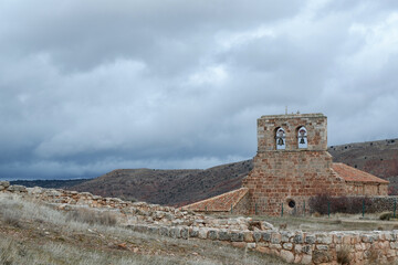 Fototapeta na wymiar Hermitage of Santa María de Tiermes is a Romanesque Catholic temple located next to the archaeological site of Tiermes, in the Spanish province of Sori. Rural Spain.
