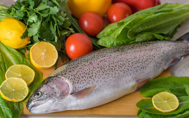 fresh fish with lemon and vegetables