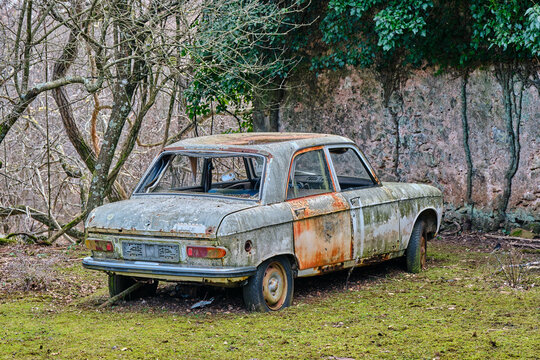 old rusty car in the field