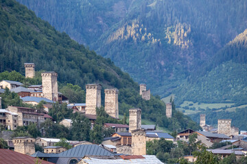 Obraz premium Panoramic view on the Svan towers in Mestia, a highland townlet, located in the High Caucasus, Svaneti Region in Georgia.The Svan watch towers have a unique defensive architectural structure. Rural