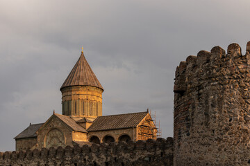 The wall of the cathedral of saint kura and the mtskheta river in the town of svetitskhoveli, a historic monument for tourism and religion in the caucasus region. Historic buildings, cathedral. © Chris
