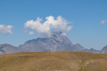 A panoramic view on the sharp mountain peaks from the Chaukhi Pass in the Greater Caucasus Mountain Range in Georgia, Kazbegi Region. Mountain Ridges, Hiking. Georgian Dolomites.