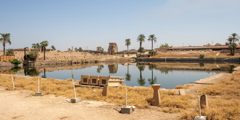 Obraz premium Reflections on the Sacred Lake at Karnak temple
