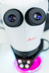 Close up laboratory microscope to analyze the sample.